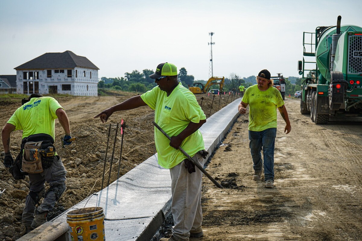 a supervisor points at something on a worksite