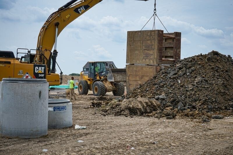 a crane lifting a heavy underground insert