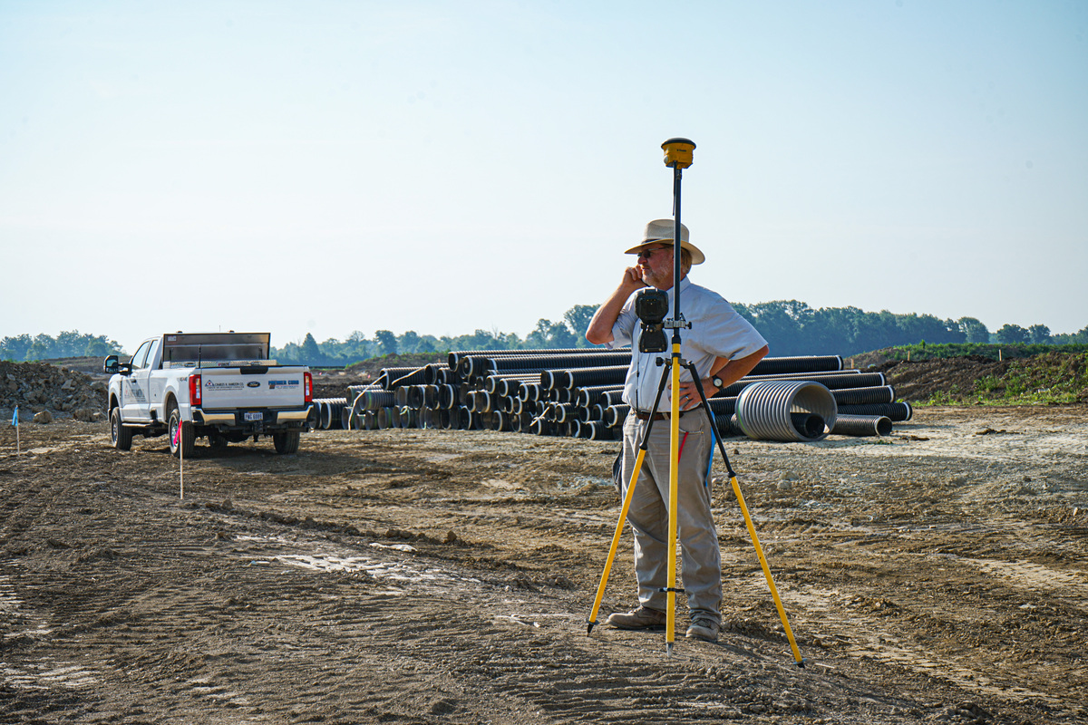 Man with camera in construction site